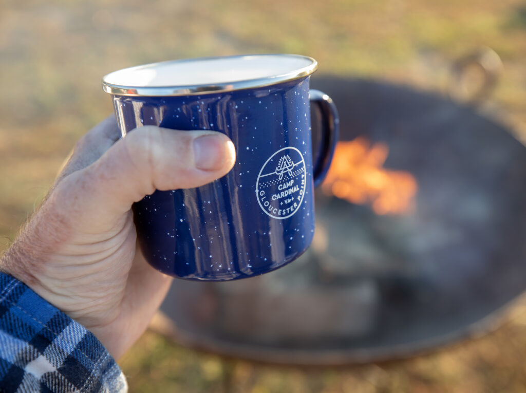 A safe campfire setup in a designated fire ring at Camp Cardinal, ideal for camping safety.