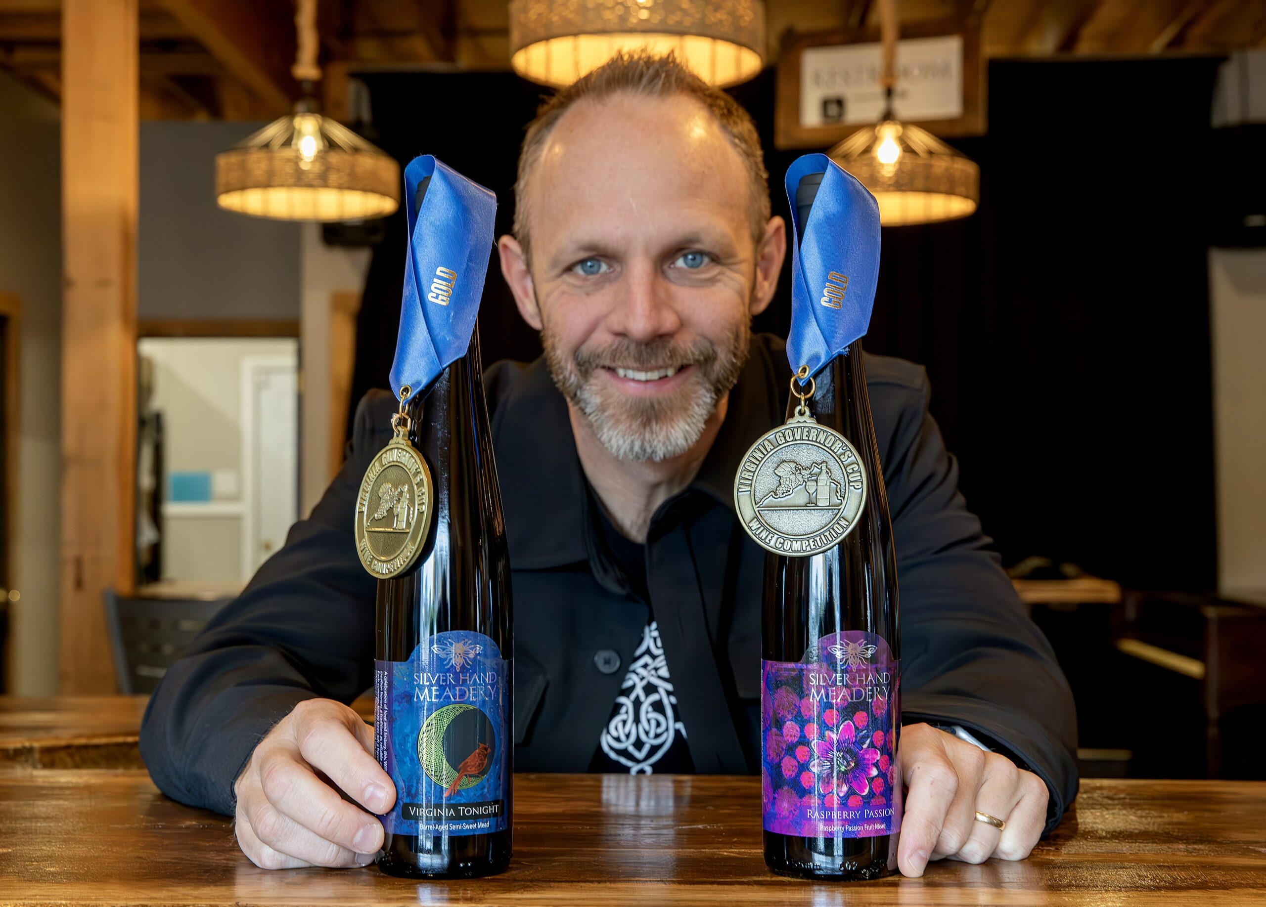 Glenn Lavender of Silver Hand Meadery poses proudly with his award-winning meads.