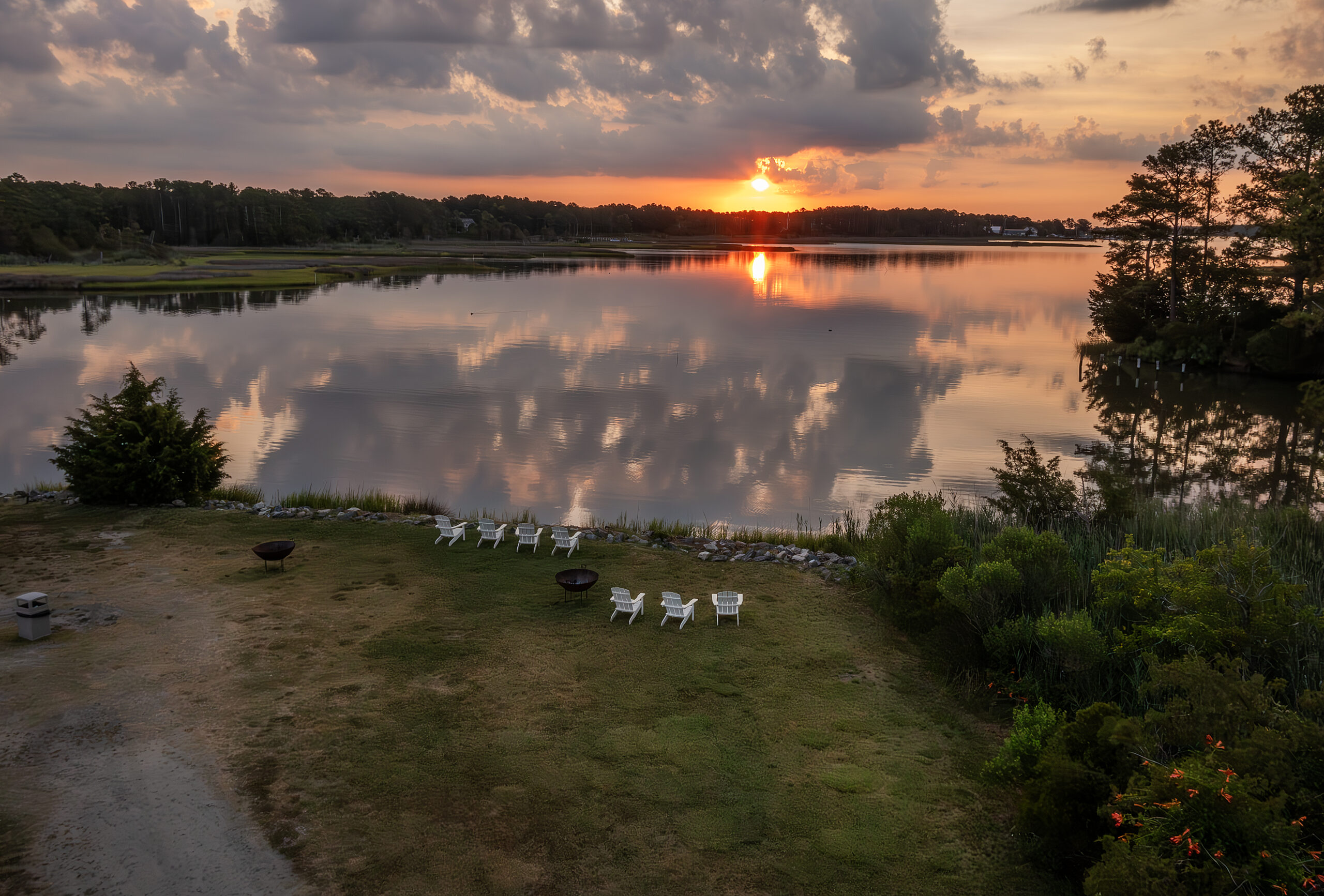 Sunset view of river and open campground at Camp Cardinal